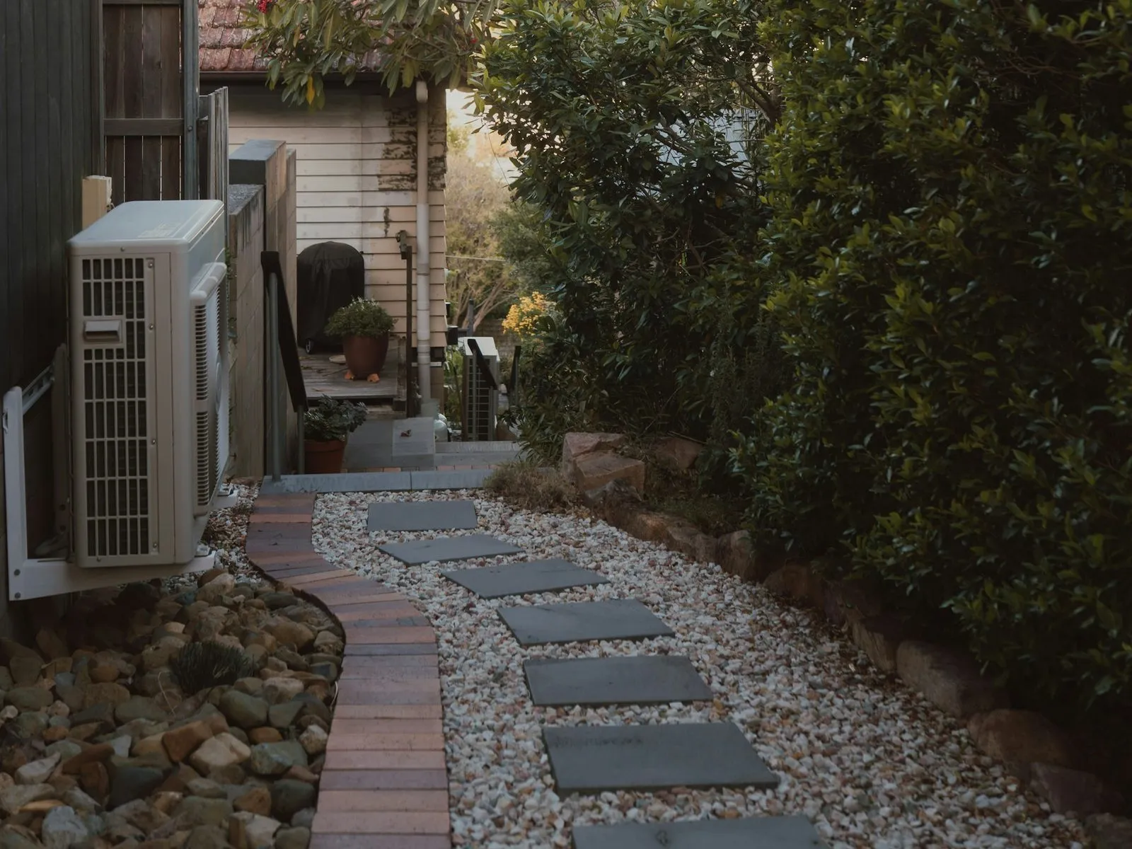 Side path of stepping stones set in white gravel